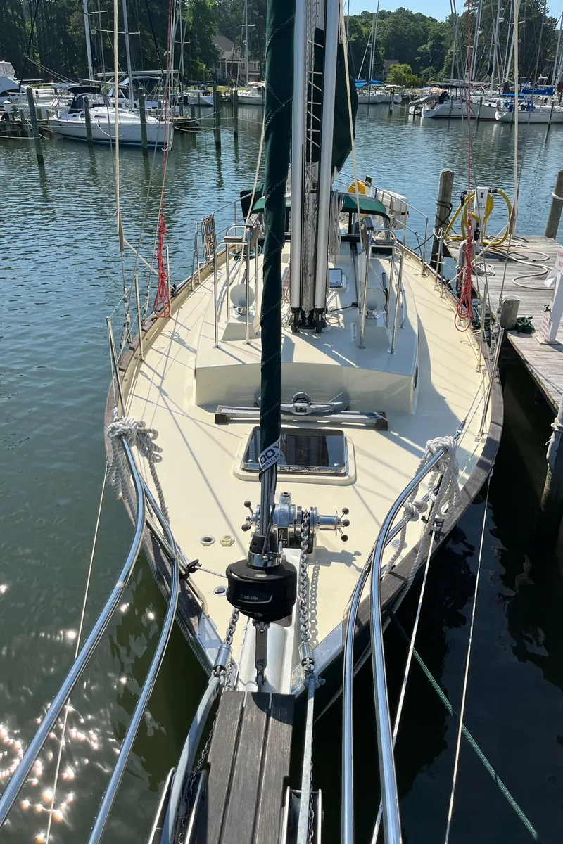 Slide: The Image of Sailboat Alajuela 38, 2016 model, docked in a marina with calm waters. - 22