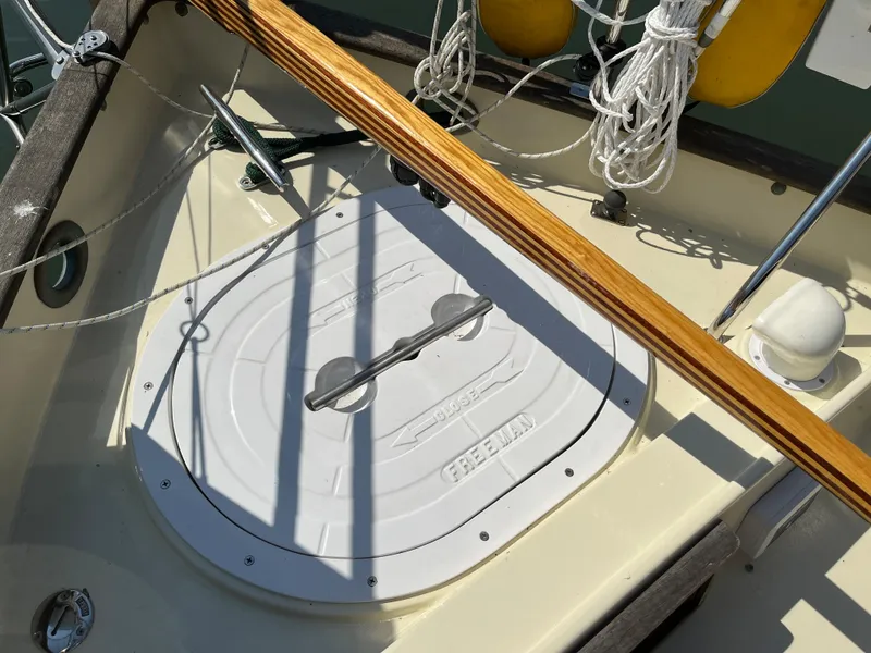 Slide: The Image of Alajuela 38 sailboat deck with hatch, ropes, and wooden handrail, 2016 model. - 3