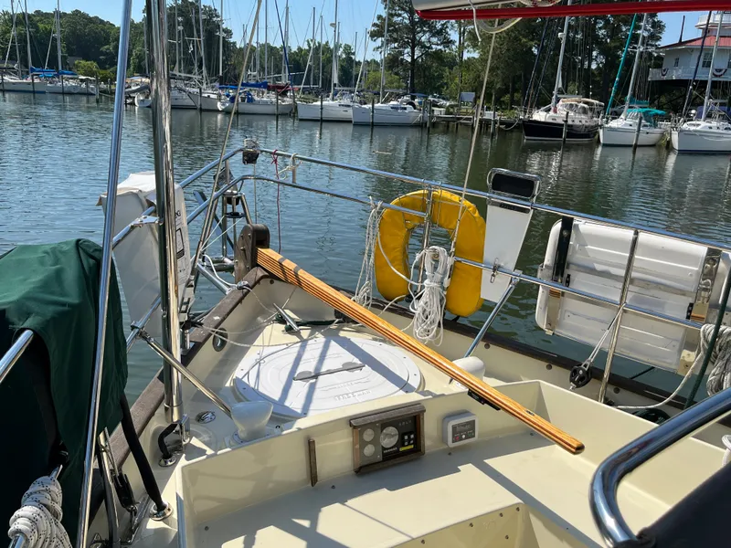 Slide: The Image of Sailboat Alajuela 38, 2016 model, docked in a marina with other boats. - 33