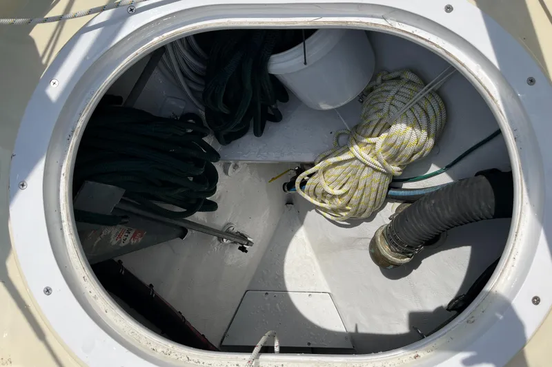 Slide: The Image of Storage compartment on a 2016 Alajuela 38 boat with ropes and equipment. - 34