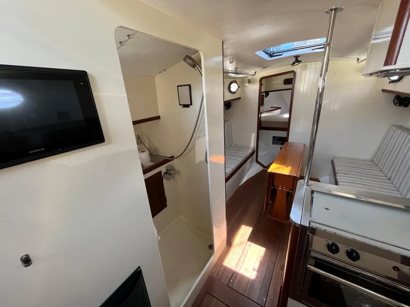 Slide: The Image of Interior of 2016 Alajuela 38 sailboat with kitchen, seating, and bathroom. - 44