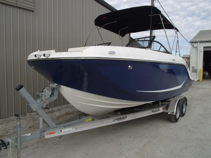 Slide: The Image of 2025 Bayliner D22 boat on trailer, blue hull. - 1