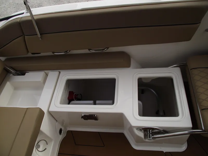 Slide: The Image of 2025 Bayliner D22 boat interior with storage compartments and seating. - 21