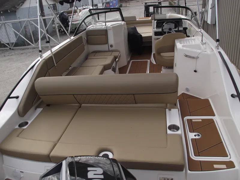 Slide: The Image of 2025 Bayliner D22 boat interior with tan seating and modern design. - 28