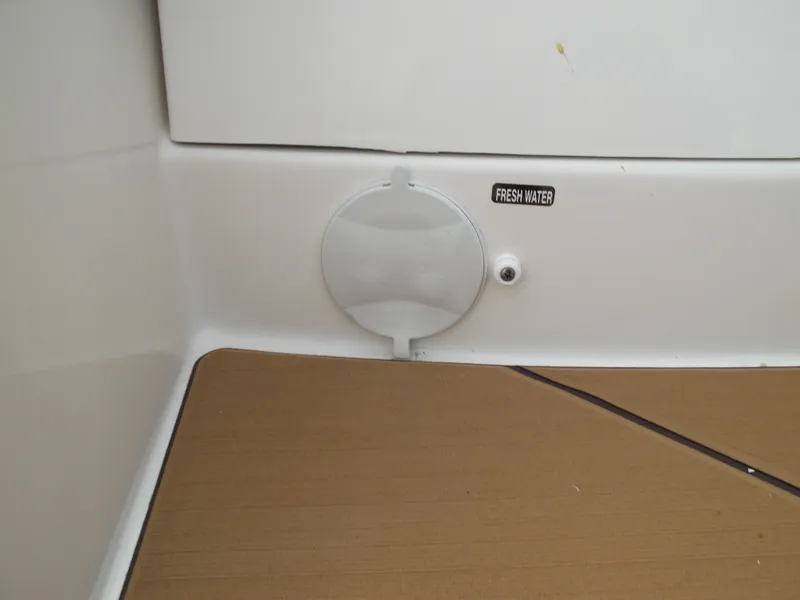 Slide: The Image of Bayliner D22 2025 boat interior with fresh water access panel. - 30