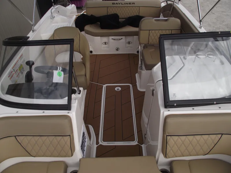Slide: The Image of 2025 Bayliner D22 boat interior with tan seating and modern design. - 31