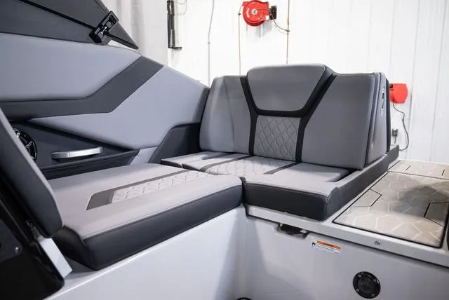 Slide: The Image of 2024 Yamaha Boats 255XE interior seating with modern gray upholstery. - 11