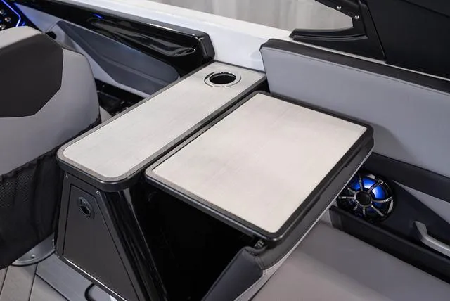 Slide: The Image of 2024 Yamaha Boats 255XE interior with sleek seating and modern design. - 13