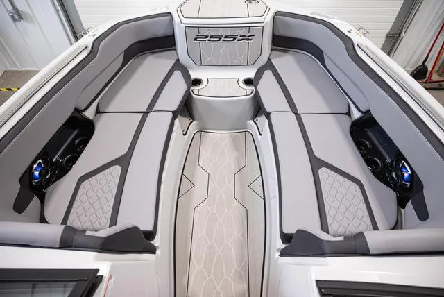Slide: The Image of 2024 Yamaha Boats 255XE interior with sleek gray seating and modern design. - 14
