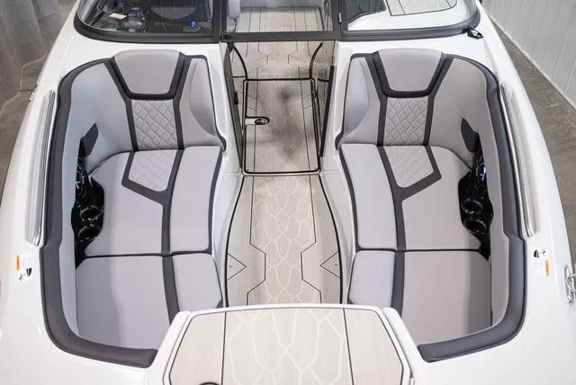 Slide: The Image of 2024 Yamaha Boats 255XE interior with stylish gray seating and modern design. - 15