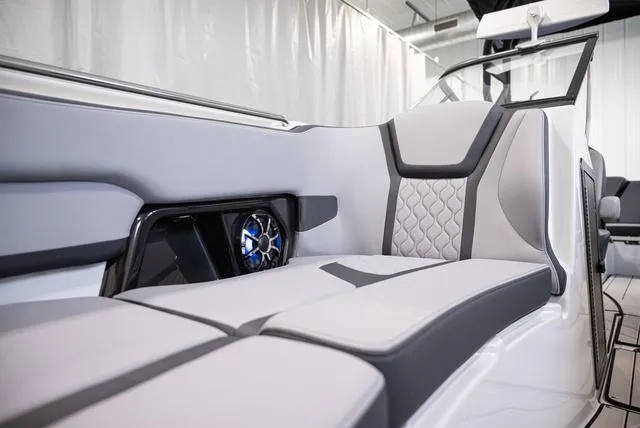 Slide: The Image of 2024 Yamaha Boats 255XE interior with sleek seating and modern design. - 16