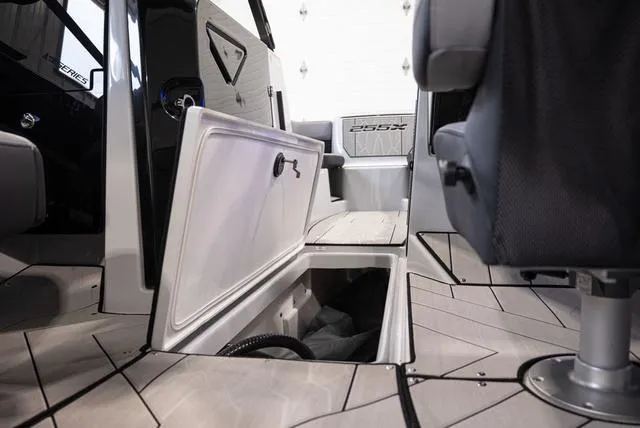 Slide: The Image of 2024 Yamaha Boats 255XE interior storage compartment and seating detail. - 19