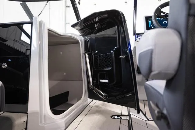 Slide: The Image of 2024 Yamaha Boats 255XE interior cabin and helm detail. - 20