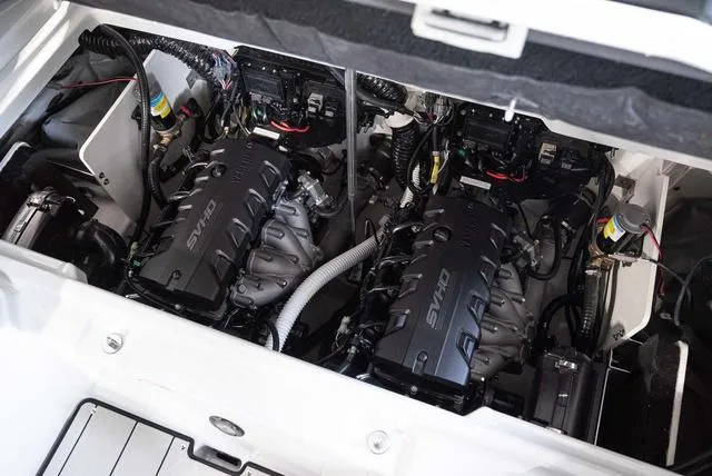 Slide: The Image of 2024 Yamaha Boats 255XE engine compartment with dual SVHO engines. - 22