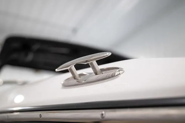 Slide: The Image of 2024 Yamaha Boats 255XE cleat detail, showcasing sleek design and craftsmanship. - 32