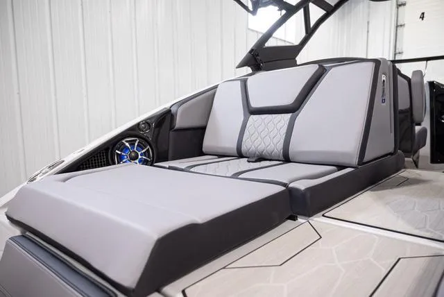 Slide: The Image of 2024 Yamaha Boats 255XE interior with sleek gray seating and modern design. - 4