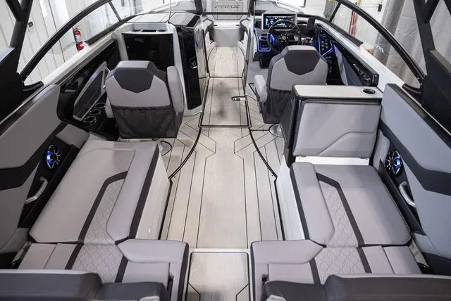 Slide: The Image of 2024 Yamaha Boats 255XE interior with modern seating and sleek design. - 5