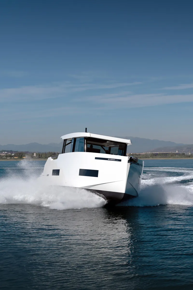 Slide: The Image of 2025 De Antonio Yachts D50 Coupé cruising on open water. - 3