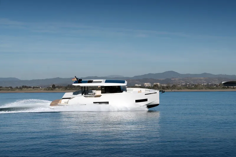 Slide: The Image of 2025 De Antonio Yachts D50 Coupé cruising on calm waters. - 8