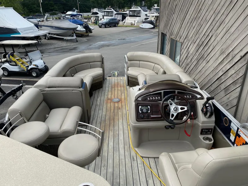 Slide: The Image of 2015 South Bay 724 E pontoon boat with spacious seating and modern dashboard. - 10