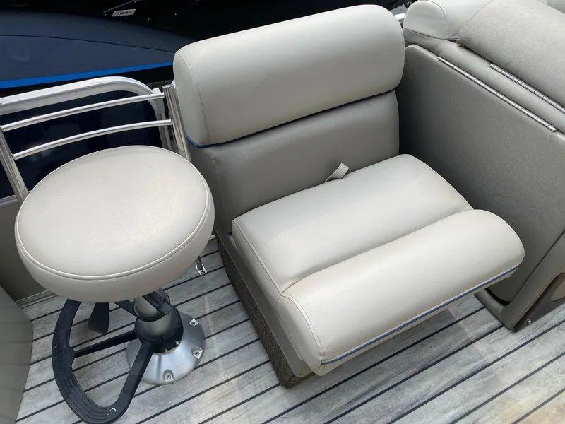 Slide: The Image of 2015 South Bay 724 E boat seating with beige upholstery on deck. - 4