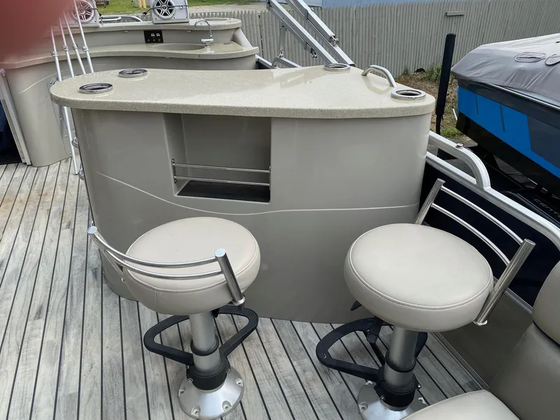 Slide: The Image of 2015 South Bay 724 E boat with bar and swivel stools on deck. - 6