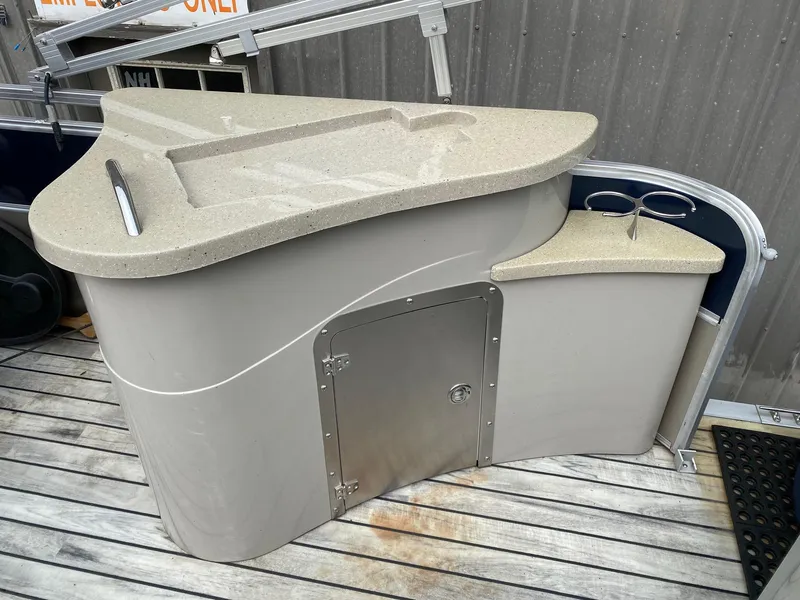 Slide: The Image of 2015 South Bay 724 E boat bar with storage on wooden deck. - 9