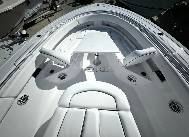 Slide: The Image of 2025 Sportsman Open 352 boat interior with seating and table. - 10
