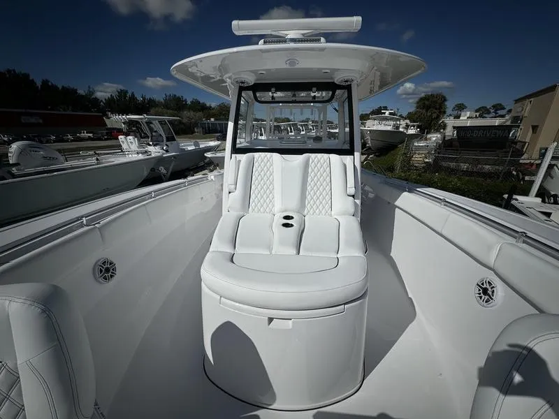 Slide: The Image of 2025 Sportsman Open 352 boat interior with white seating and modern design. - 14