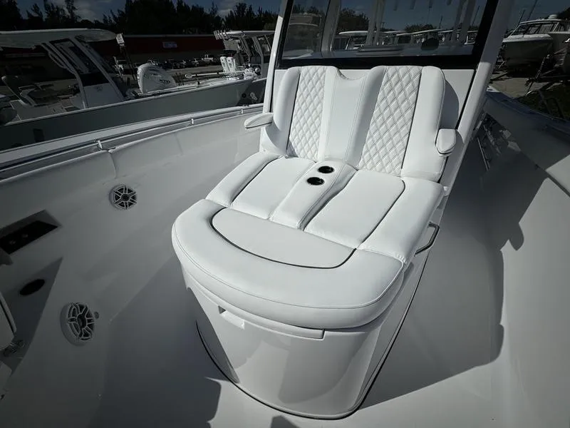 Slide: The Image of Luxurious seating on 2025 Sportsman Open 352 boat, featuring white quilted upholstery. - 15