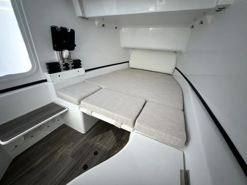 Slide: The Image of 2025 Sportsman Open 352 cabin interior with cushioned seating and modern design. - 20