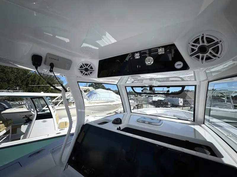 Slide: The Image of 2025 Sportsman Open 352 boat interior with modern dashboard and controls. - 33