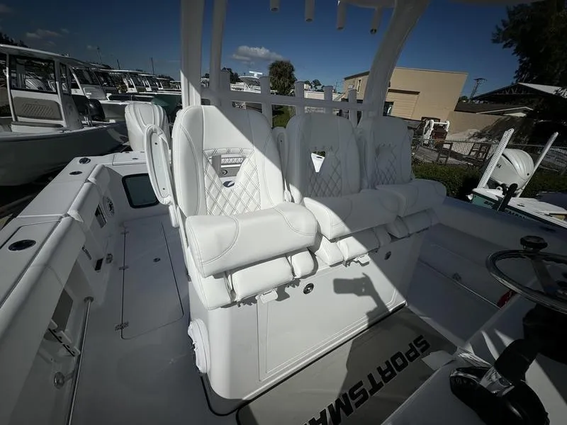 Slide: The Image of 2025 Sportsman Open 352 boat interior with luxurious white seating and modern design. - 35