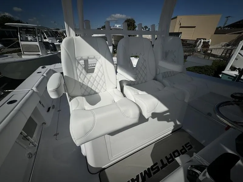 Slide: The Image of 2025 Sportsman Open 352 boat with luxurious white seating and modern design. - 36