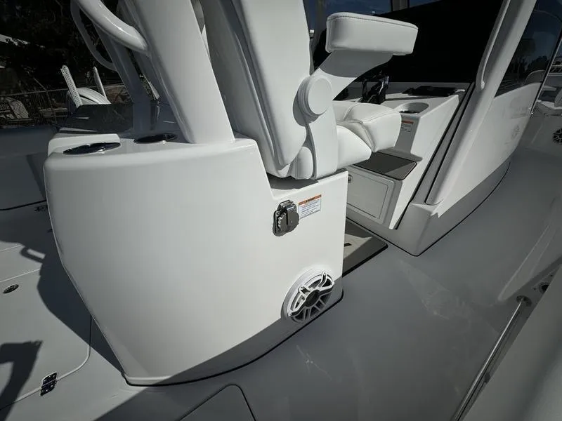 Slide: The Image of 2025 Sportsman Open 352 boat interior, featuring sleek white seating and modern design elements. - 37