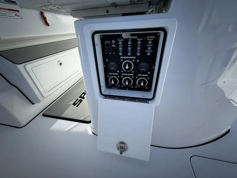 Slide: The Image of Control panel of 2025 Sportsman Open 352 boat, featuring various switches and dials. - 38