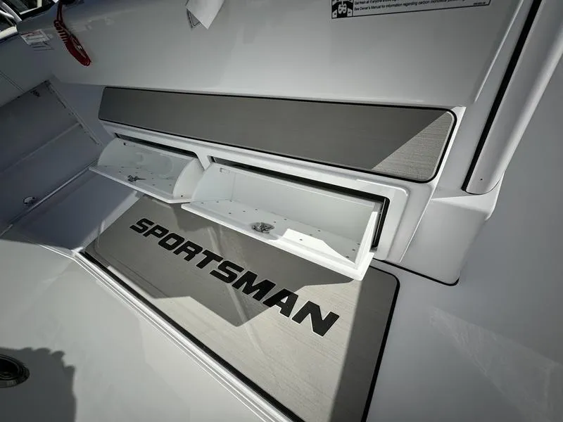 Slide: The Image of 2025 Sportsman Open 352 boat interior with storage compartments open. - 40