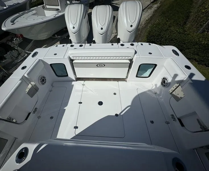 Slide: The Image of 2025 Sportsman Open 352 boat deck with triple engines, spacious layout, and modern design. - 41
