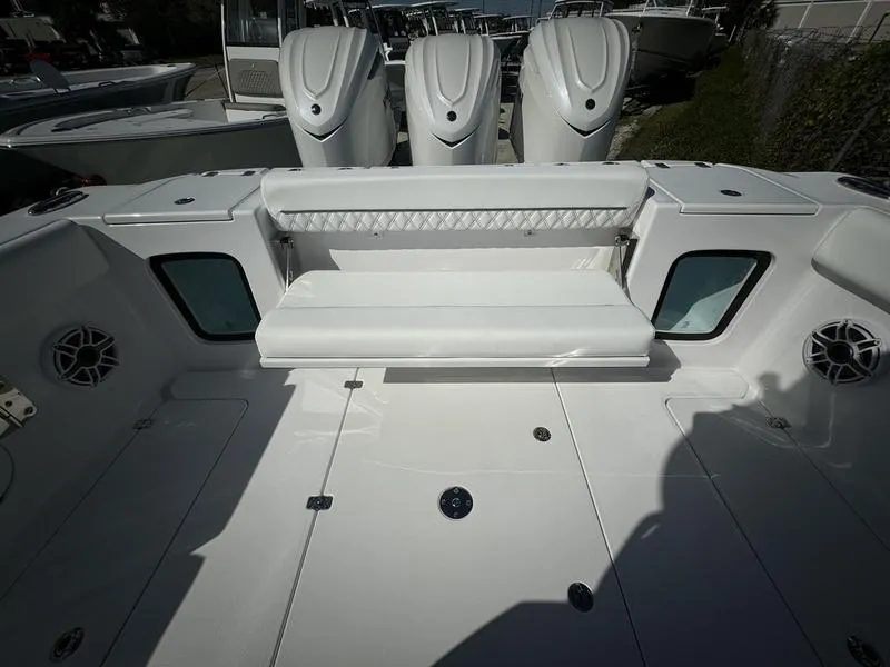 Slide: The Image of 2025 Sportsman Open 352 boat interior with seating and triple engines. - 43