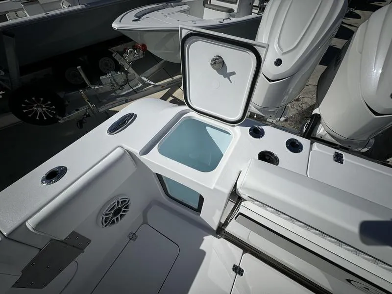 Slide: The Image of 2025 Sportsman Open 352 boat interior with storage compartment and seating area. - 49