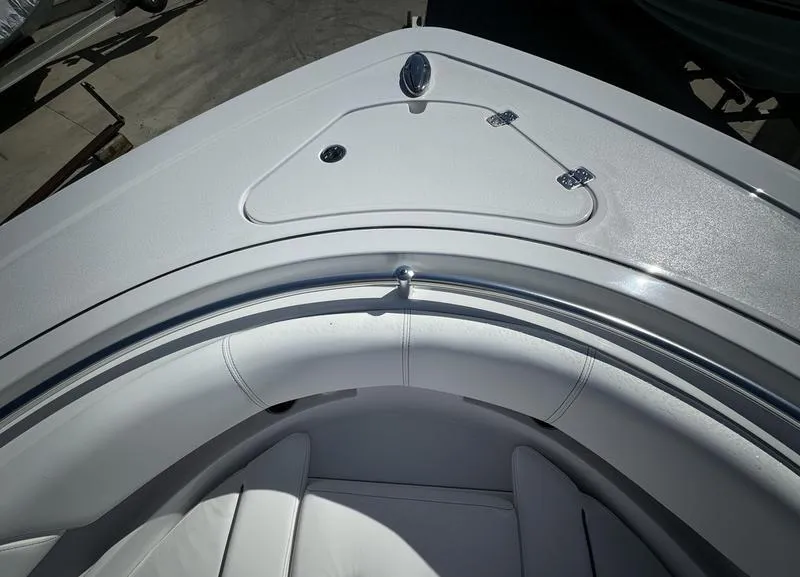 Slide: The Image of 2025 Sportsman Open 352 boat bow with sleek white seating and storage compartment. - 5