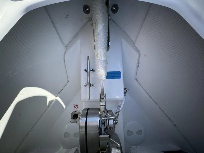 Slide: The Image of 2025 Sportsman Open 352 boat interior detail, showcasing anchor storage and mechanical components. - 7
