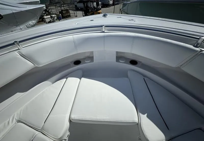 Slide: The Image of 2025 Sportsman Open 352 boat interior with white cushioned seating. - 8