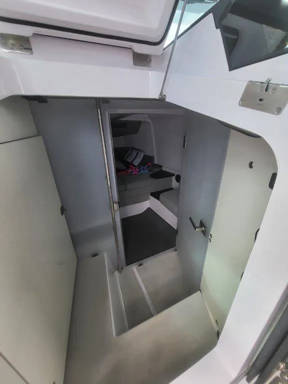 Slide: The Image of Interior cabin of 2024 Axopar 37 XC CROSS CABIN, featuring modern design and compact space. - 27