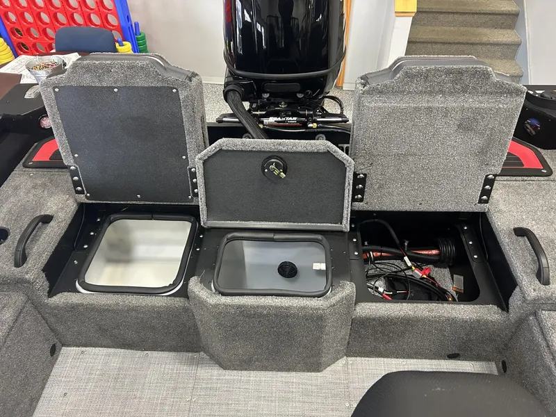 Slide: The Image of 2024 Alumacraft Competitor FSX 185 boat storage compartments and engine view. - 10