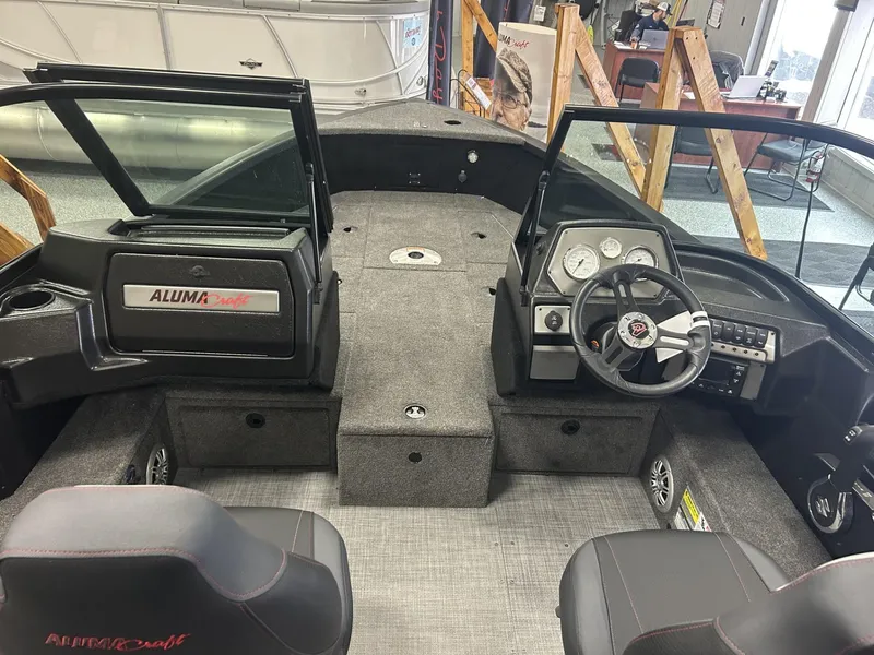 Slide: The Image of 2024 Alumacraft Competitor FSX 185 boat interior with dual consoles and seating. - 6