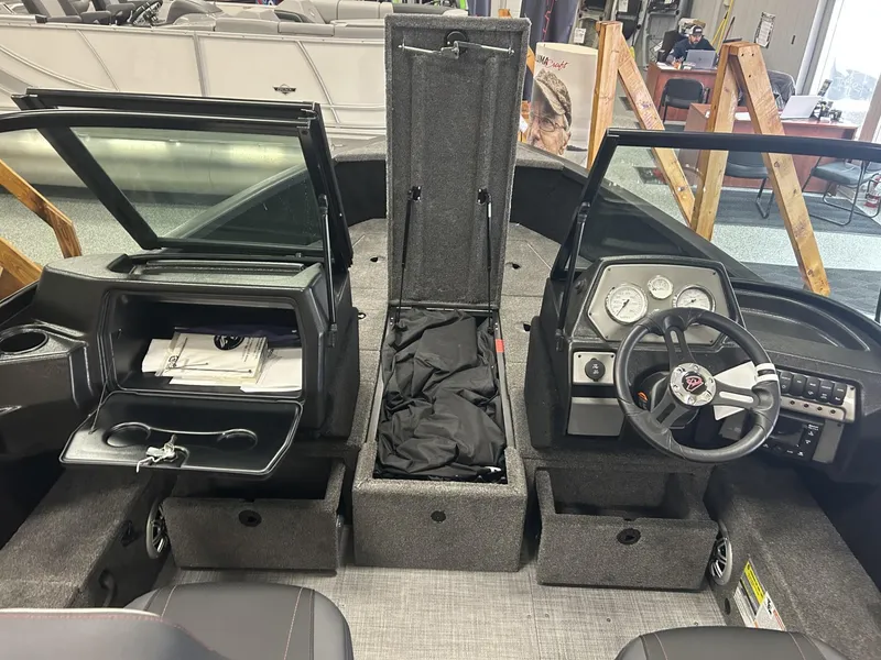 Slide: The Image of 2024 Alumacraft Competitor FSX 185 interior with storage compartments and dashboard. - 7