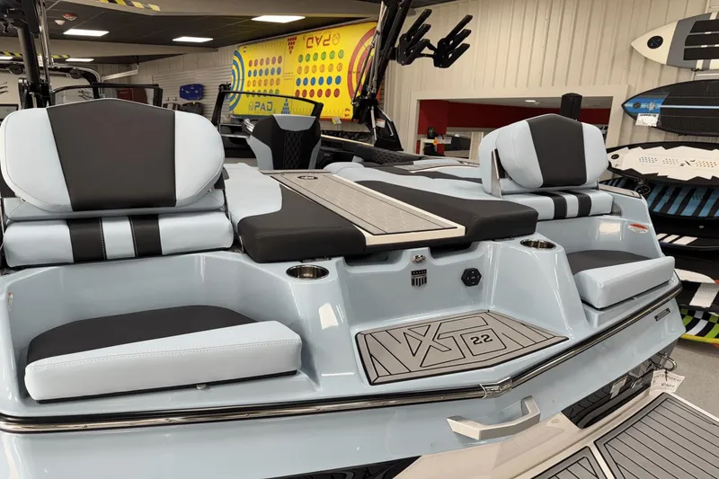 Slide: The Image of 2025 MasterCraft XT22 boat interior with sleek seating and modern design. - 22