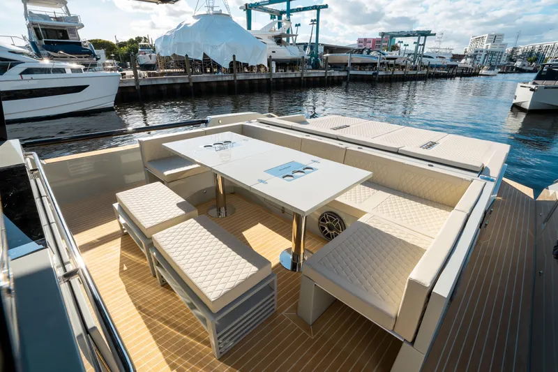 Slide: The Image of Luxurious seating area on 2025 De Antonio Yachts D50 OPEN, docked at marina. - 19