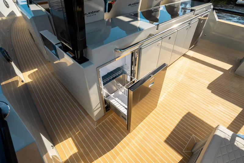 Slide: The Image of De Antonio Yachts D50 OPEN 2025, sleek deck with open fridge, modern design. - 27